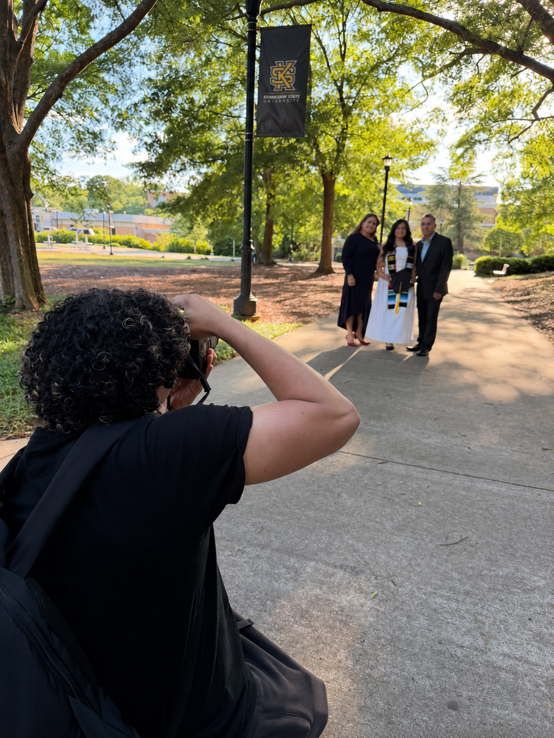 Jordanny photographing a graduation portrait session