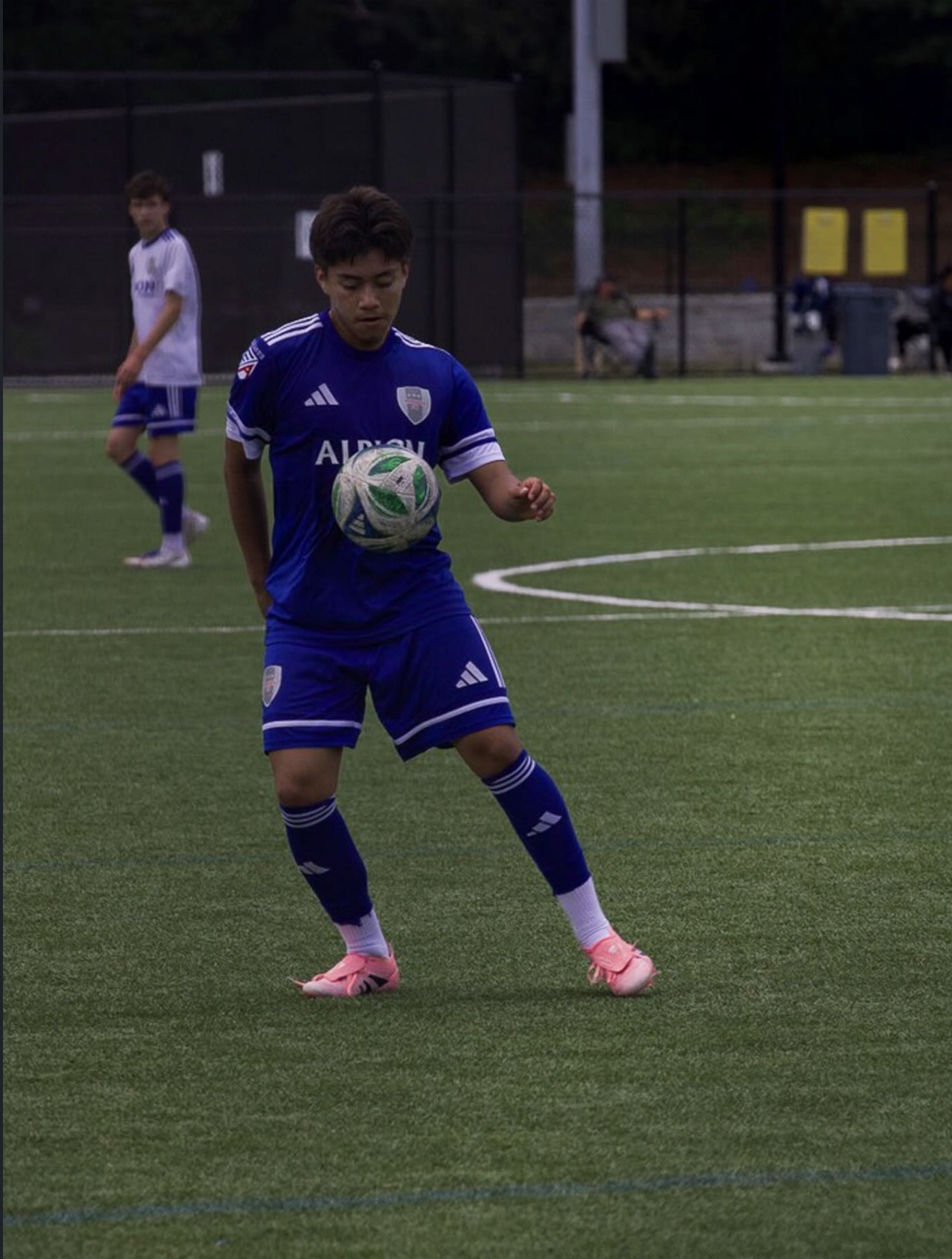 Soccer player controlling the ball on the field