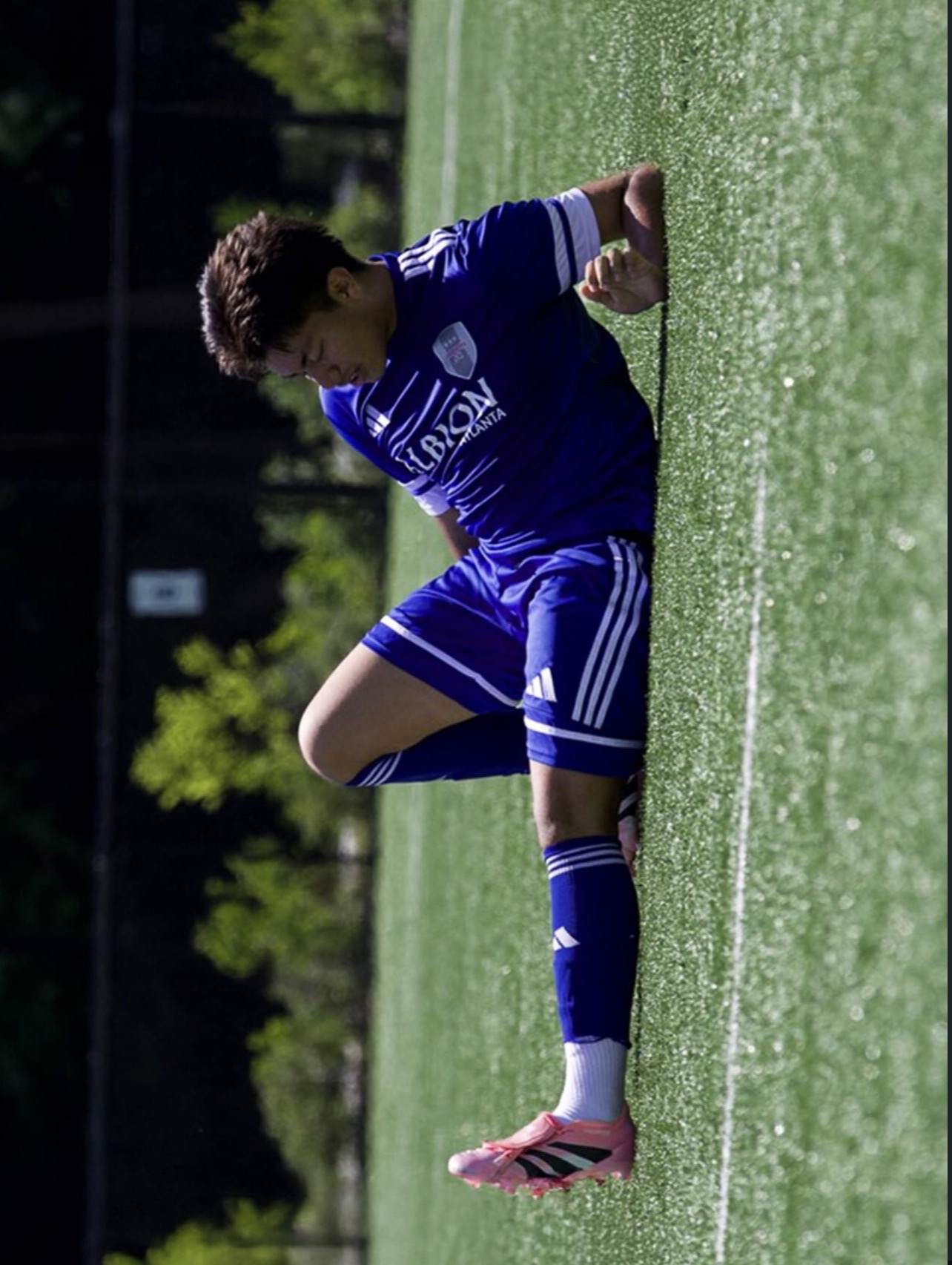 Soccer player captured in motion during the match