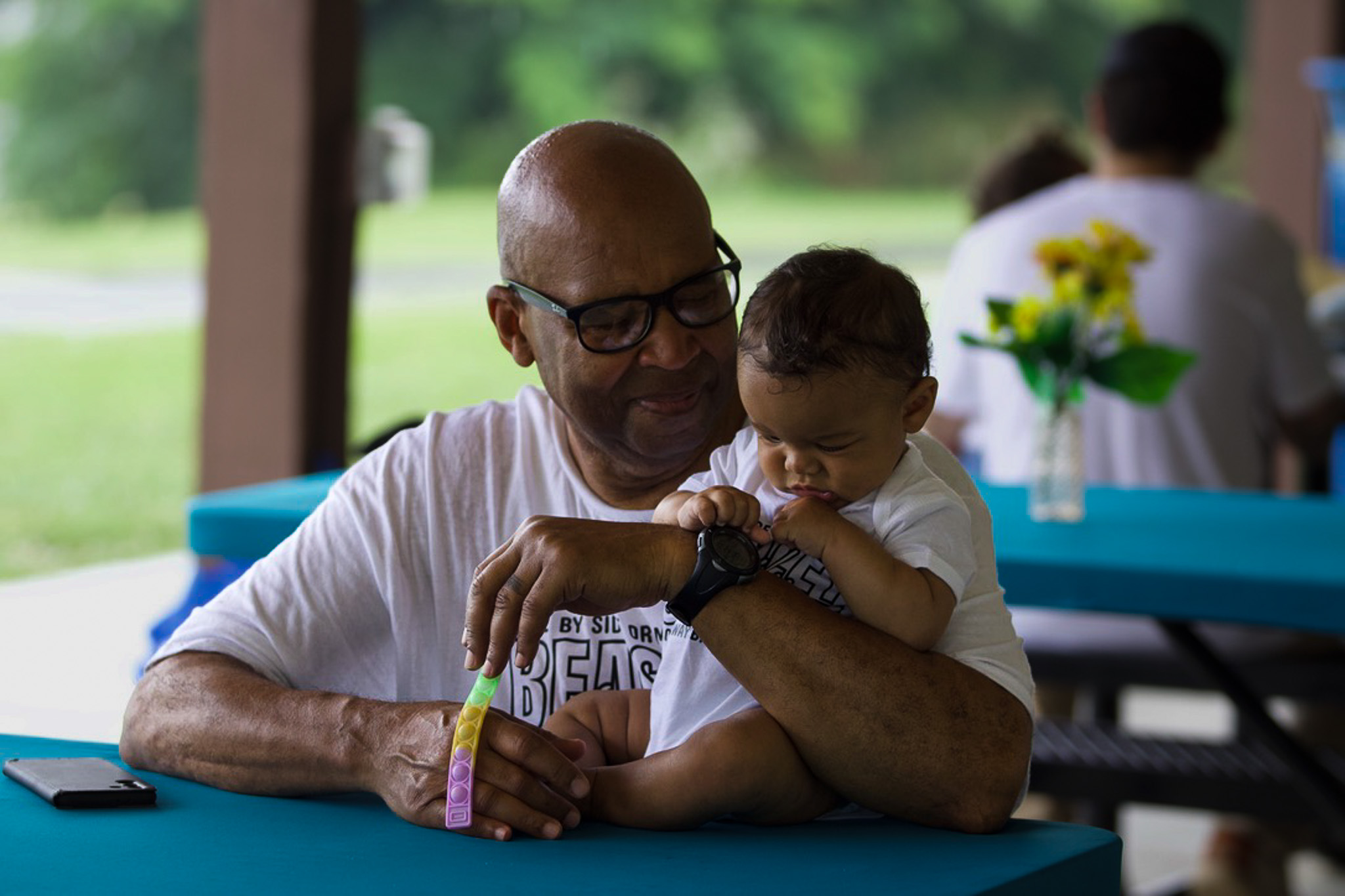 A grandfather sharing a tender moment with a baby